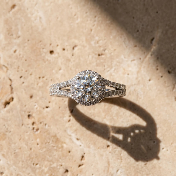 White gold Round Cut Solitaire Diamond with Pavé Twist Band and Four-Prong Setting