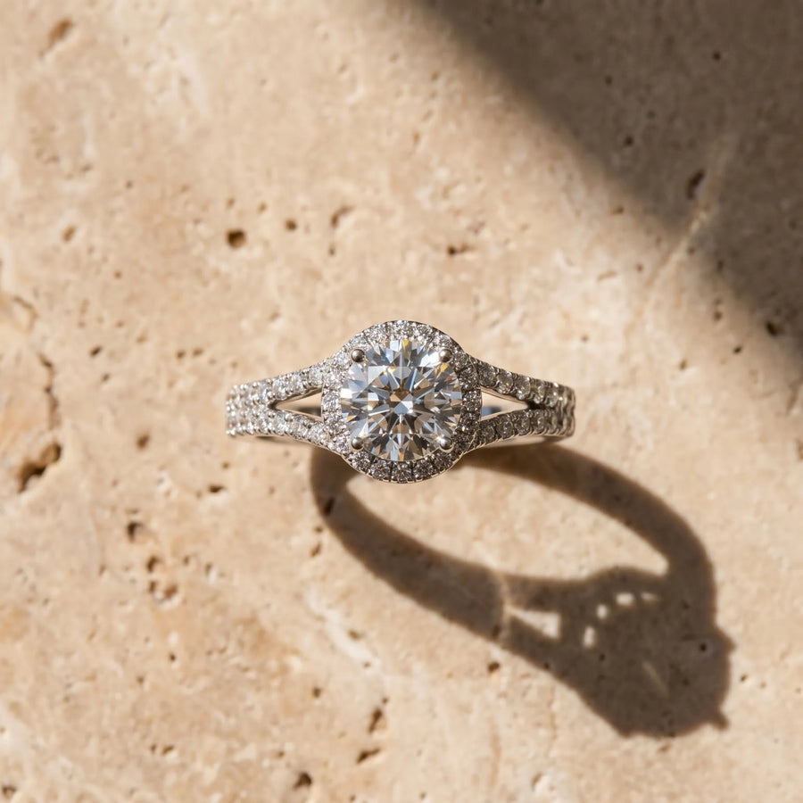 White gold Round Cut Solitaire Diamond with Pavé Twist Band and Four-Prong Setting