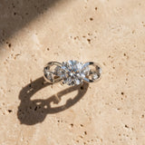 White gold Round Cut Solitaire Diamond with Side Stones on Criss-Cross Band and Four-Prong Setting_16