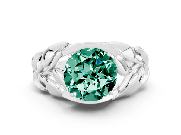 Platinum Round Cut Green Sapphire Leaf-Inspired Engagement Ring with Round Accents and Prong Setting