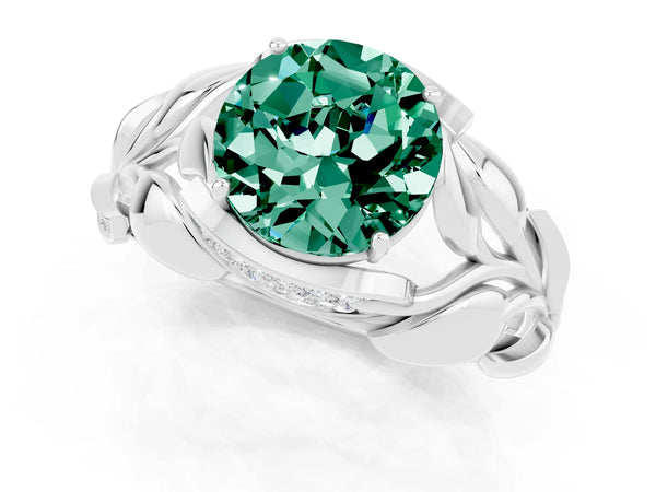 Platinum Round Cut Green Sapphire Leaf-Inspired Engagement Ring with Round Accents and Prong Setting