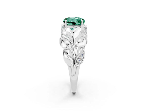Platinum Round Cut Green Sapphire Leaf-Inspired Engagement Ring with Round Accents and Prong Setting