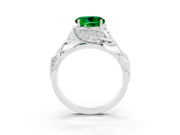 Platinum Round Cut Emerald Leaf-Inspired Engagement Ring with Round Accents and Prong Setting