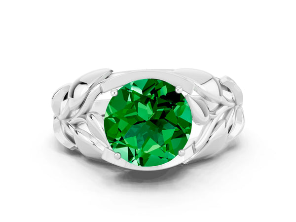 Platinum Round Cut Emerald Leaf-Inspired Engagement Ring with Round Accents and Prong Setting