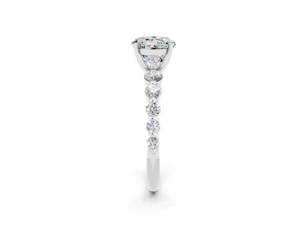 Platinum Round Cut Solitaire Moissanite Ring with Pave Band and Four-Prong Setting