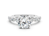 White gold Round Cut Solitaire Moissanite Ring with Pave Band and Four-Prong Setting