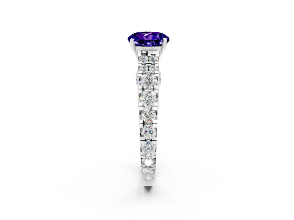 Platinum Round Cut Tanzanite Classic Solitaire Ring with Pavé Band and Four-Prong Setting