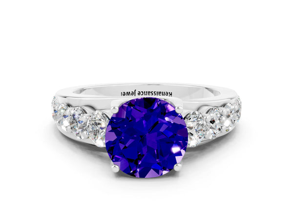 Platinum Round Cut Tanzanite Engagement Ring with Pavé Band and Four-Prong Setting