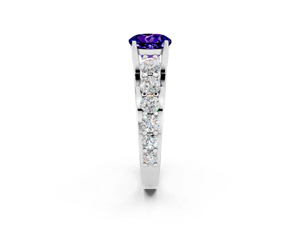 Platinum Round Cut Tanzanite Engagement Ring with Pavé Band and Four-Prong Setting