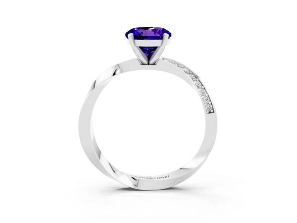 Platinum Round Cut Tanzanite Engagement Ring with Side Stone Accents and Four-Prong Setting