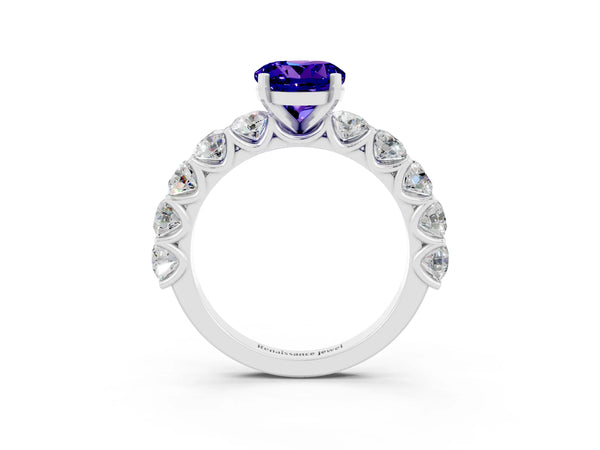 Platinum Round Cut Tanzanite Prong Setting with Side Stones on a Pave Band