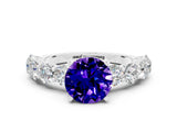 White gold Round Cut Tanzanite Prong Setting with Side Stones on a Pave Band