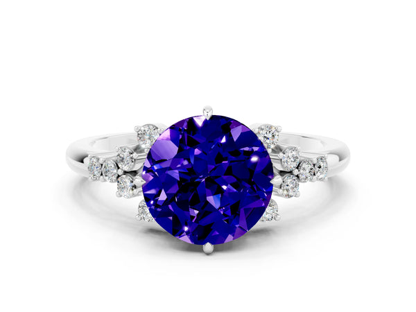 Platinum Round Cut Tanzanite Ring with Side Stones and Four-Prong Setting