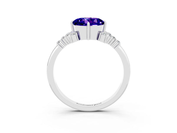 Silver Round Cut Tanzanite Ring with Side Stones and Four-Prong Setting