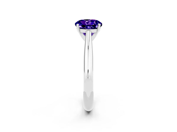 Platinum Round Cut Tanzanite Solitaire Engagement Ring with Cathedral Setting and Four-Prong Mount