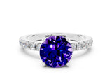 White gold Round Cut Tanzanite Solitaire Pavé Band with Four-Prong Setting