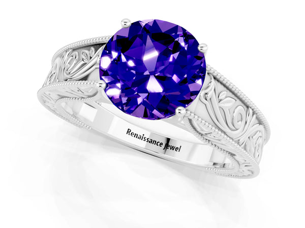 Platinum Round Cut Tanzanite Solitaire Ring with Engraved Band and Four-Prong Setting