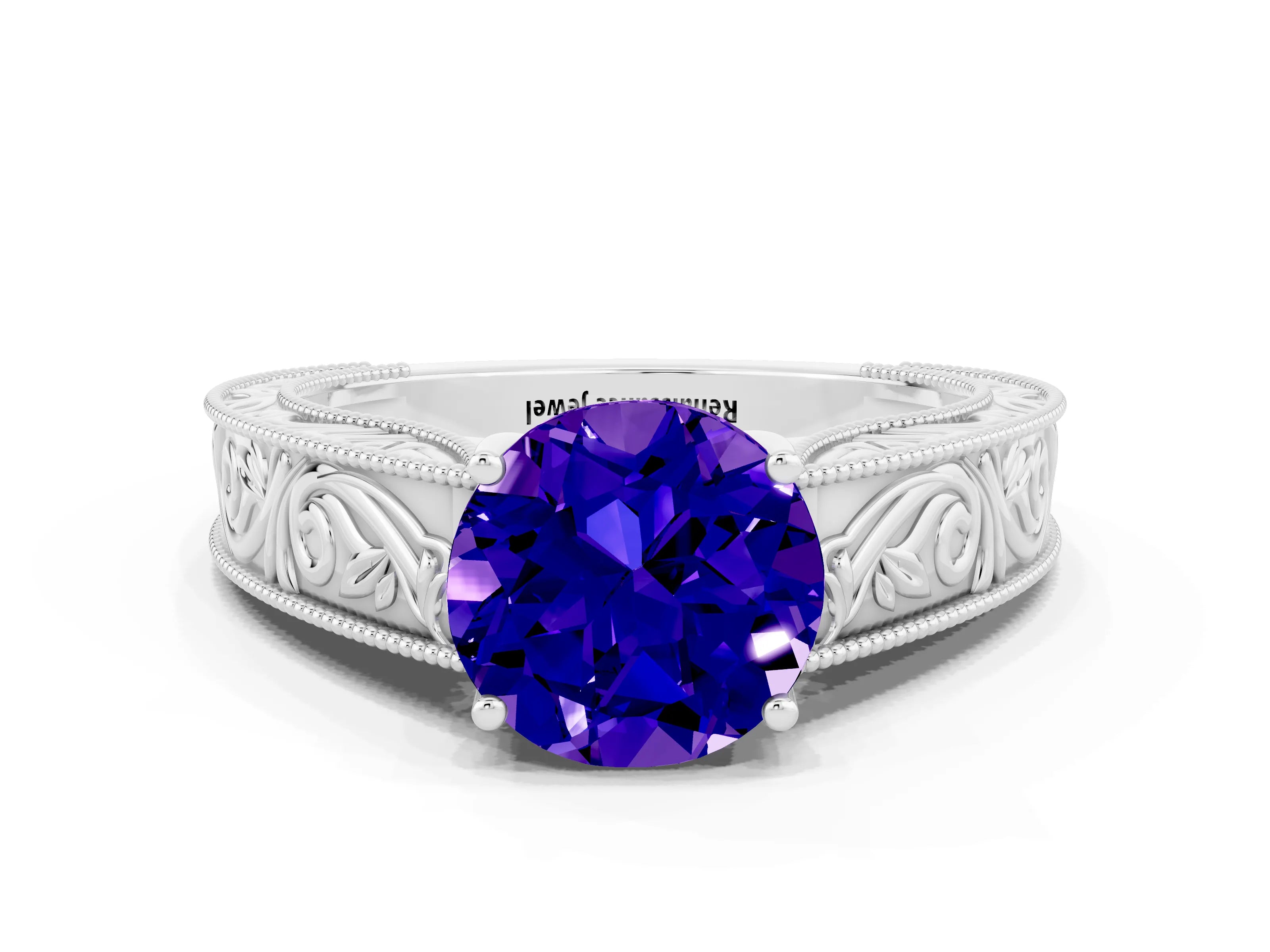 White gold Round Cut Tanzanite Solitaire Ring with Engraved Band and Four-Prong Setting