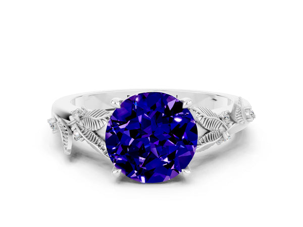 Platinum Round Cut Tanzanite Solitaire Ring with Leaf Motif Band and Four-Prong Setting