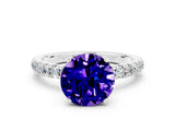 White gold Round Cut Tanzanite Solitaire Ring with Pavé Accents and Four-Prong Setting