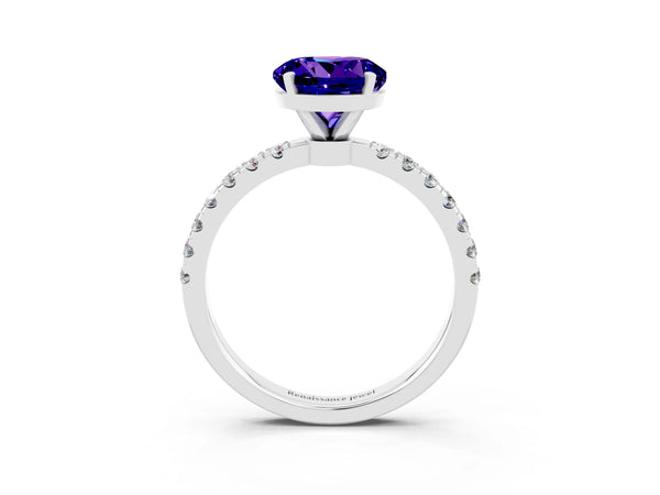 Platinum Round Cut Tanzanite Solitaire Ring with Pavé Accents and Four-Prong Setting