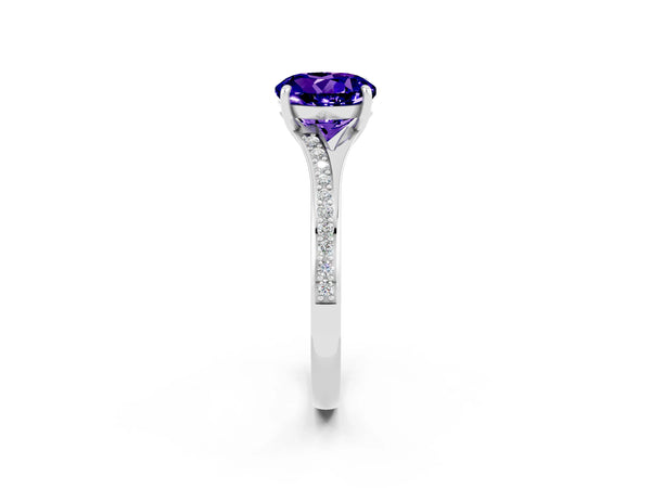 Platinum Round Cut Tanzanite Solitaire Ring with Pavé Band and Prong Setting