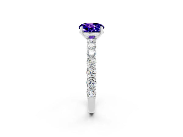 Platinum Round Cut Tanzanite Solitaire Ring with Shared Prong Pavé Band and Four-Prong Setting