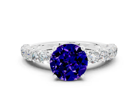 White gold Round Cut Tanzanite Solitaire Ring with Shared Prong Pavé Band and Four-Prong Setting