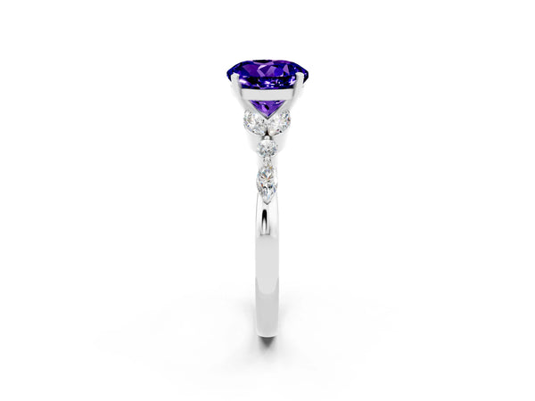 Platinum Round Cut Tanzanite Solitaire Ring with Side Stones and Four-Prong Setting