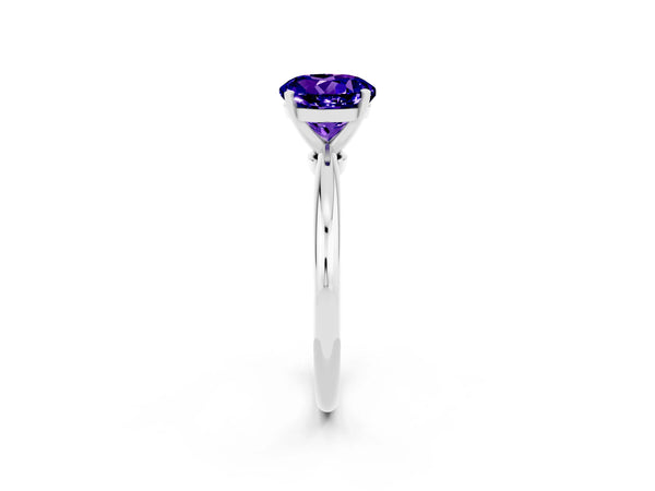 Platinum Round Cut Tanzanite Solitaire Ring with Six-Prong Setting and Classic Band