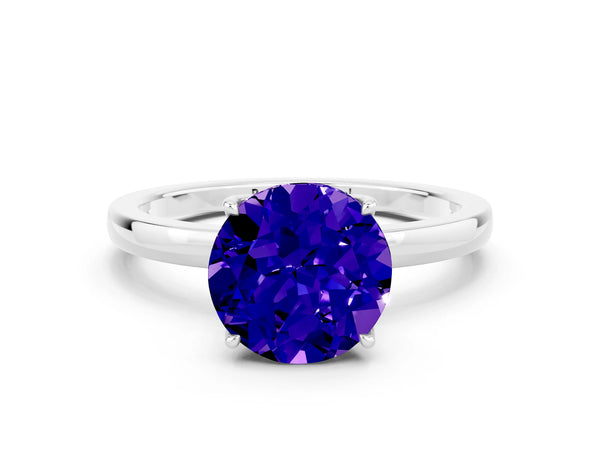 Platinum Round Cut Tanzanite Solitaire Ring with Thin Band and Prong Setting