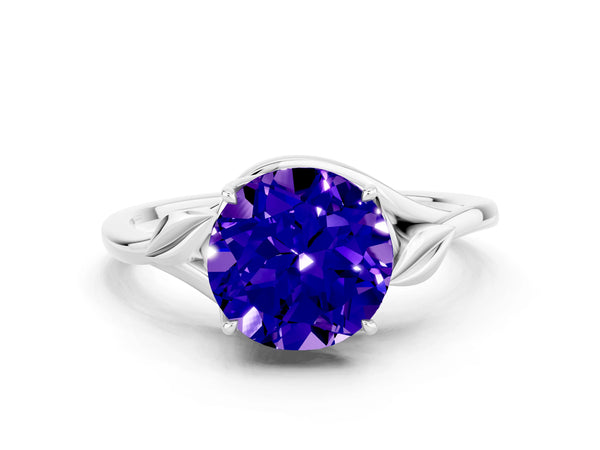 Silver Round Cut Tanzanite Solitaire Ring with Twist Band and Four-Prong Setting