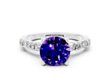 White gold Round Cut Tanzanite Solitaire with Side Baguettes and Channel Set Band