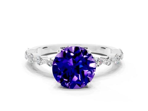 White gold Round Cut Tanzanite Solitaire with Side Stones on a Pavé Band and Four-Prong Setting