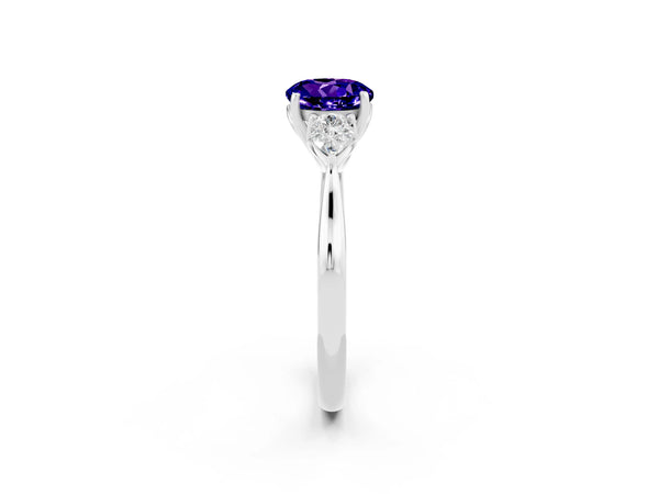 Platinum Round Cut Tanzanite Three-Stone Ring with Pear  Side Stones and Prong Setting
