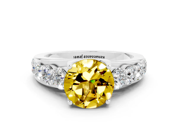 Silver Round Cut Yellow Sapphire Engagement Ring with Pavé Band and Four-Prong Setting