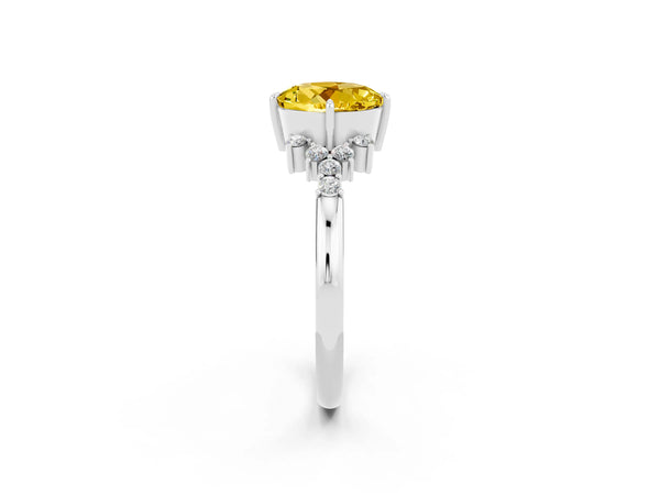 Silver Round Cut Yellow Sapphire Ring with Side Stones and Four-Prong Setting