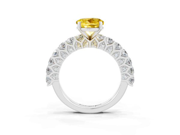 Platinum Round Cut Yellow Sapphire Solitaire Ring with Shared Prong Pavé Band and Four-Prong Setting