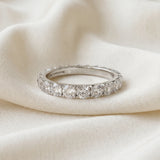 Platinum Round Diamond Eternity Band with Pavé Setting and Shared Prong