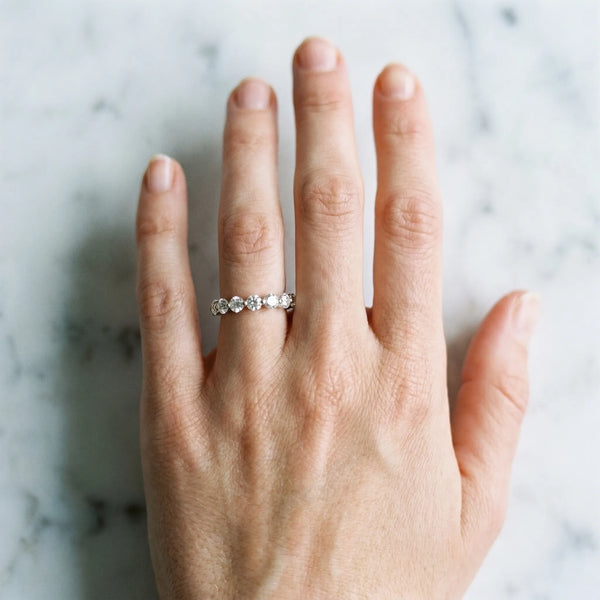 White gold Round Diamond Eternity Band with Shared Prong Setting