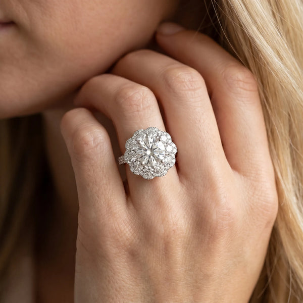 White gold Round Diamond Floral Halo Ring with Pavé Band and Four-Prong Setting
