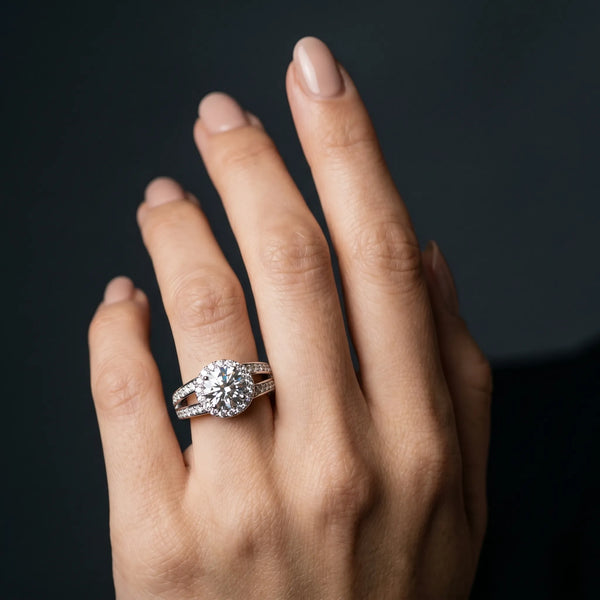 White gold Round Diamond Halo Ring with Split Shank Pavé Band and Four-Prong Setting