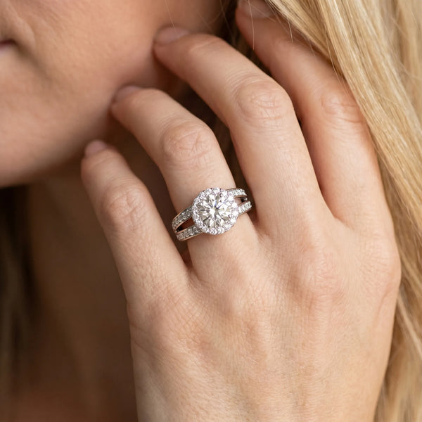 White gold Round Diamond Halo Ring with Split Shank Pavé Band and Four-Prong Setting