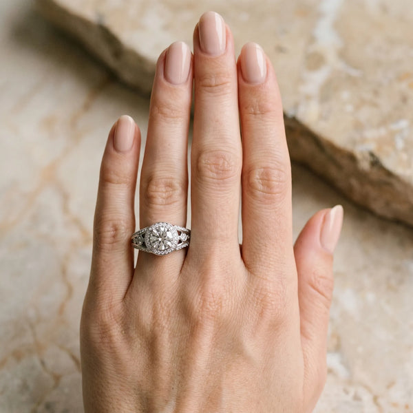 White gold Round Diamond Halo Ring with Split Shank and Bezel Accents and Four-Prong Setting