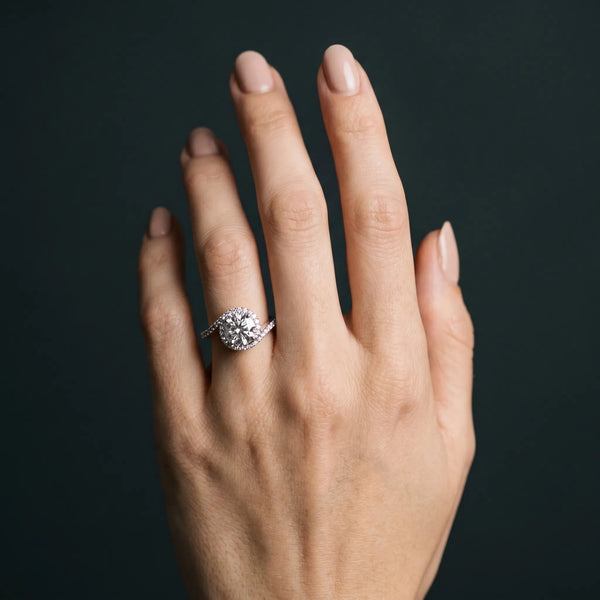 White gold Round Diamond Halo Ring with Twisted Pavé Band and Four-Prong Setting