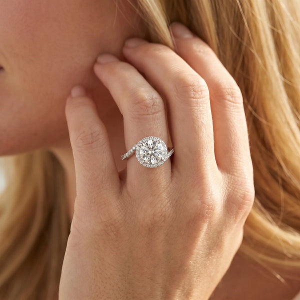 White gold Round Diamond Halo Ring with Twisted Pavé Band and Four-Prong Setting
