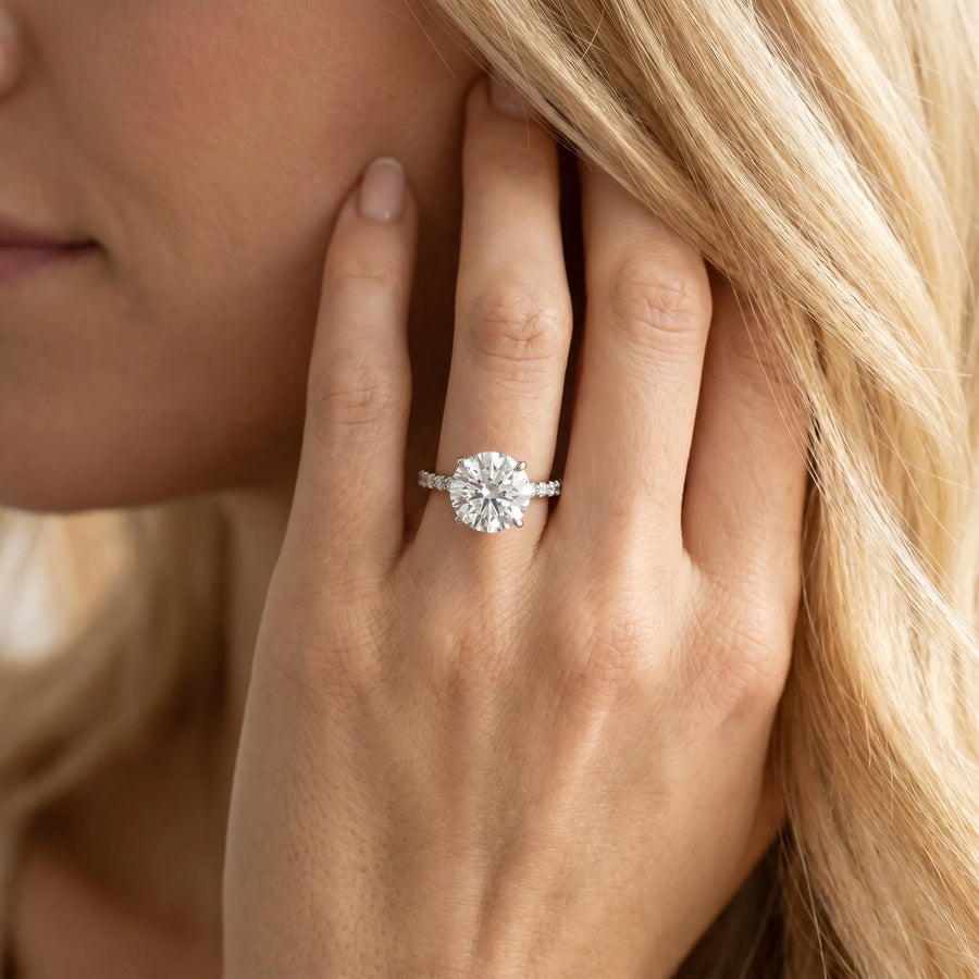 White gold Round Diamond Solitaire Ring with Four-Prong Setting and Pavé Band