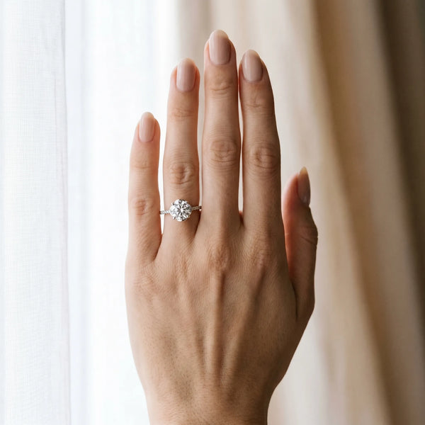 White gold Round Diamond Solitaire Ring with Pavé Accent Band and Four-Prong Setting