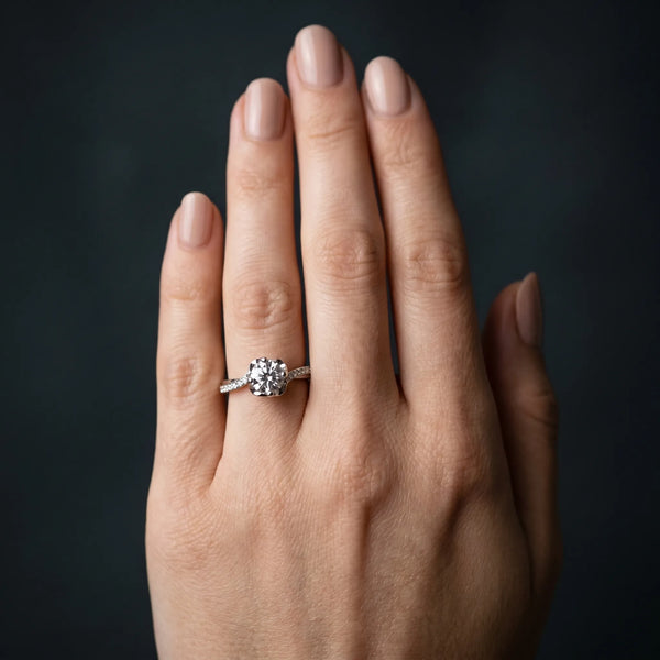 White gold Round Diamond Solitaire Ring with Pavé Band and Sculpted Prong Setting