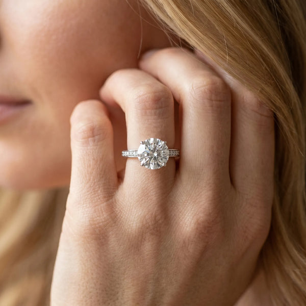 White gold Round Diamond Solitaire with Pave Band and Six-Prong Setting